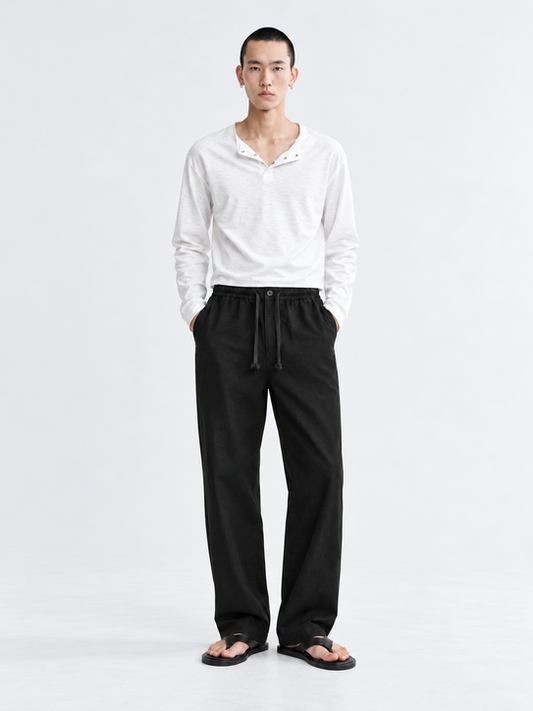 DILI men's black relaxed straight-fit drawstring trousers styled with a white Henley T-shirt.