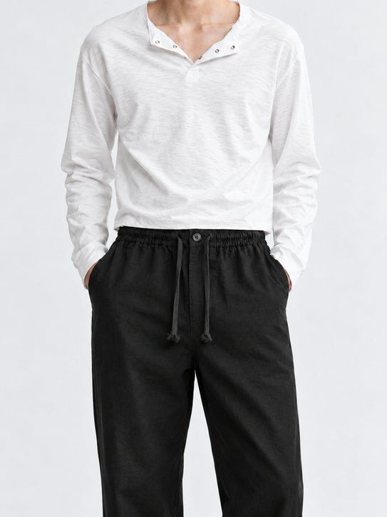 DILI men's black relaxed straight-fit drawstring trousers styled with a white Henley T-shirt.