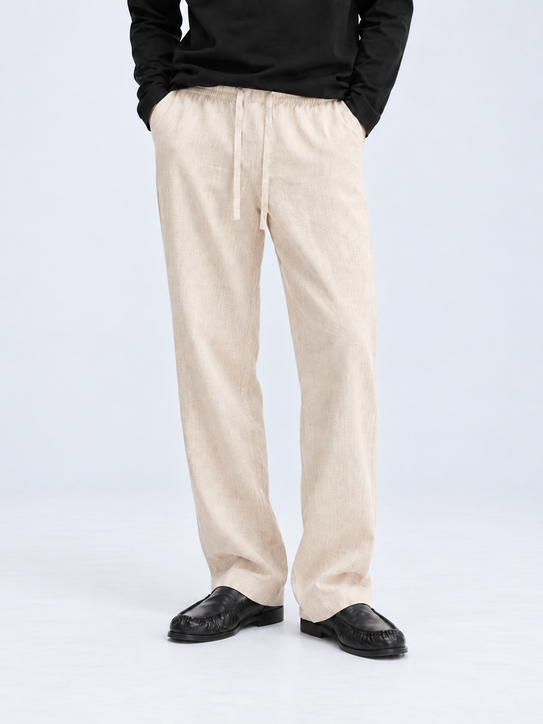 DILI men's beige relaxed straight-fit trousers, front view with drawstring waist.
