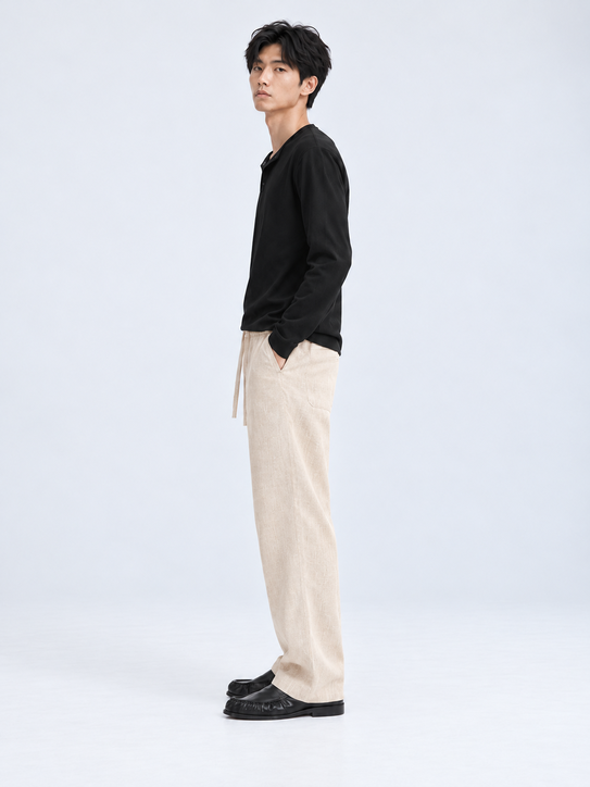 DILI men's beige relaxed straight-fit trousers, front view with drawstring waist.