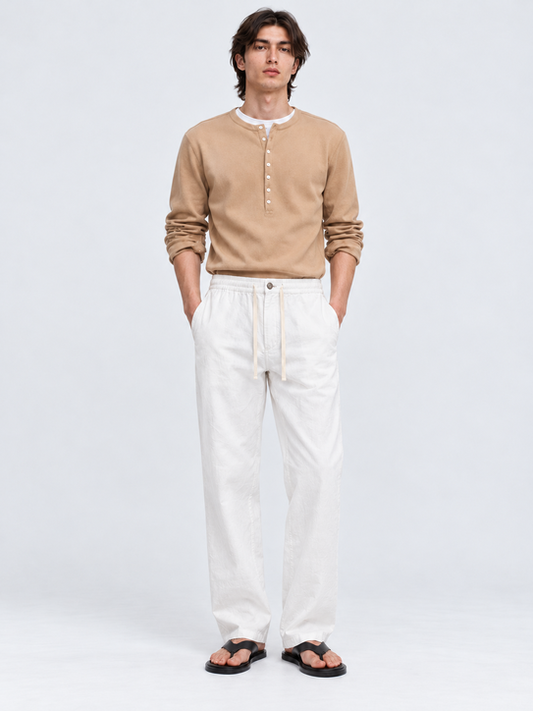 DILI men's white relaxed straight-fit trousers with adjustable drawstrings, styled with a beige Henley T-shirt.