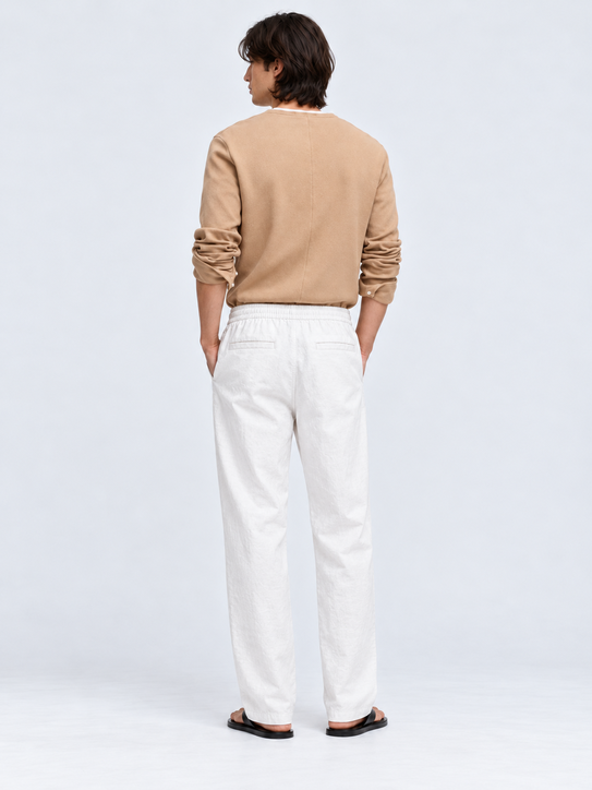 DILI men's white relaxed straight-fit trousers with adjustable drawstrings, styled with a beige Henley T-shirt.