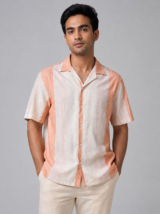 Man wearing a peach and cream striped linen-cotton half-sleeve shirt