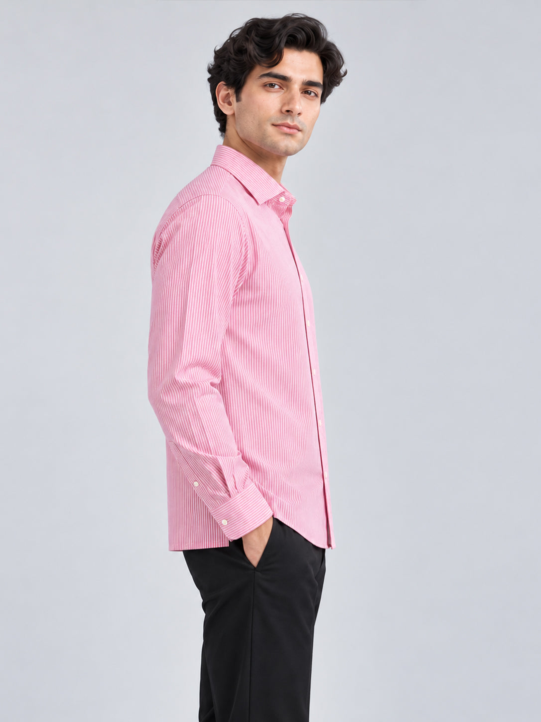 Side view of men's pink striped shirt with straight hem
