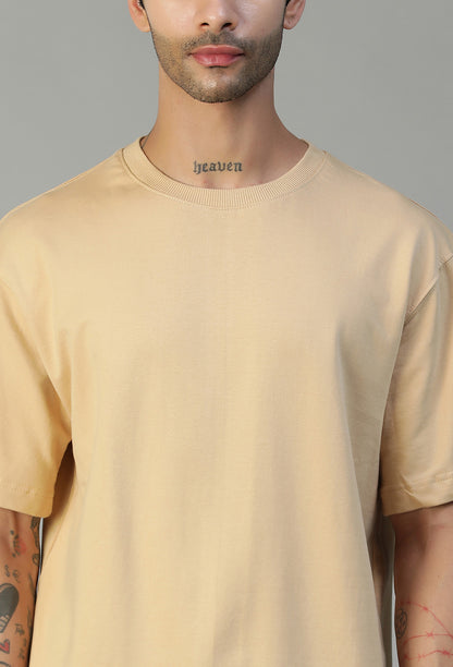 Close-up of beige cotton oversized T-shirt crew neck and fabric