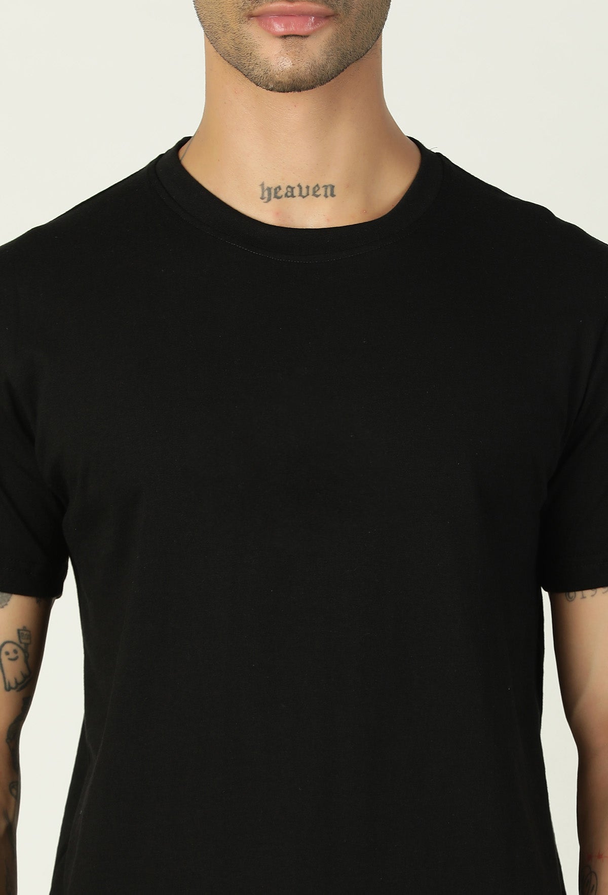 Close-up of solid black cotton T-shirt crew neck and fabric