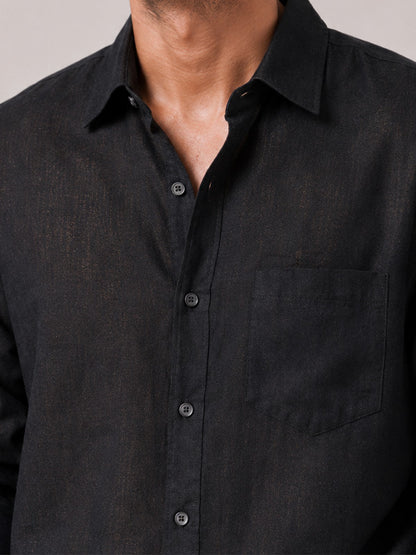 Close-up of black linen-cotton shirt collar, buttons and fabric