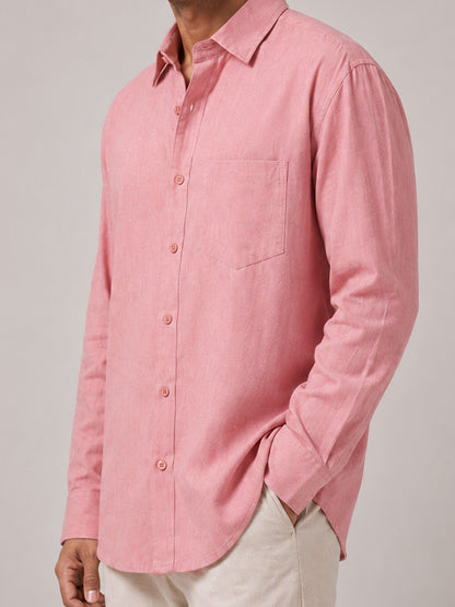 Close-up of blush pink linen-cotton shirt fabric, buttons and chest pocket