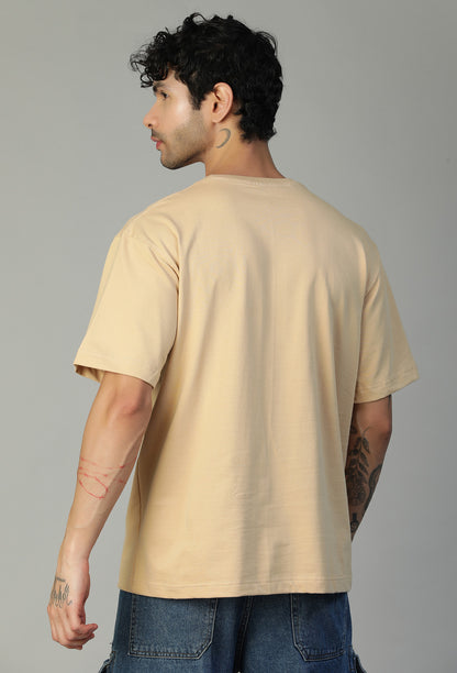 Back view of men's solid beige oversized half-sleeve T-shirt