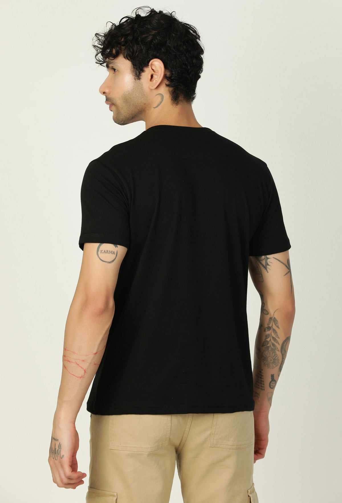 Back view of men's solid black cotton half-sleeve T-shirt
