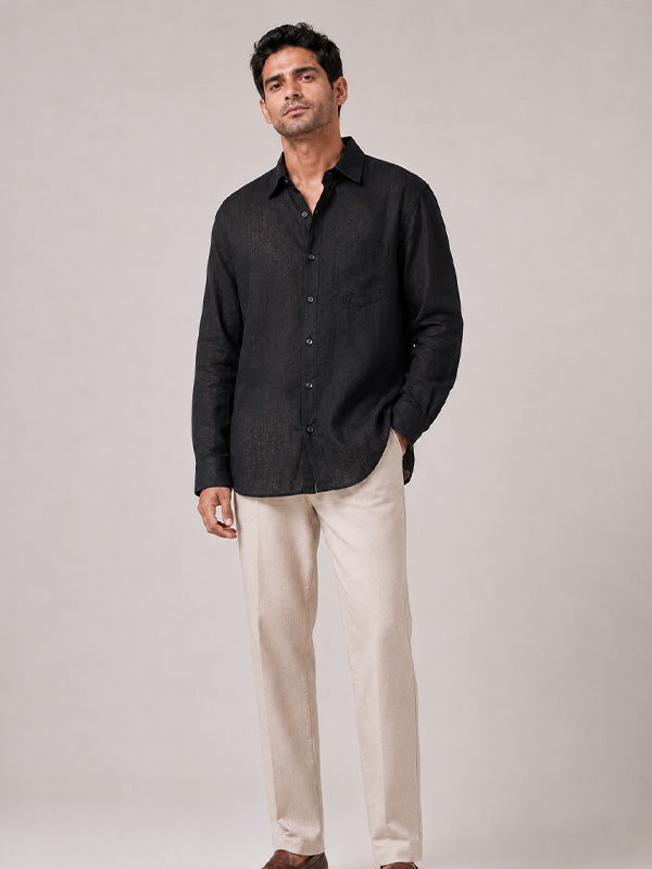 Man wearing a black linen-cotton relaxed-fit full-sleeve shirt