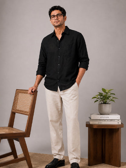 Men's black linen-cotton shirt styled with beige trousers
