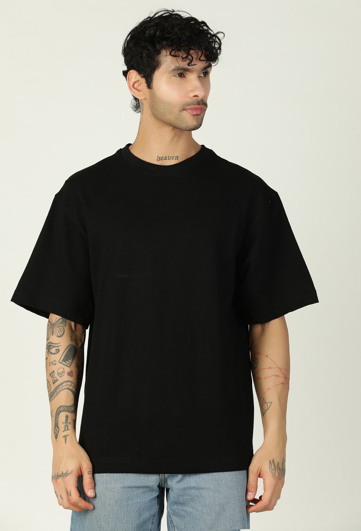 Front view of men's solid black oversized half-sleeve T-shirt