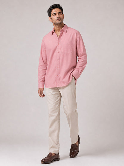Man wearing a blush pink linen-cotton relaxed-fit full-sleeve shirt