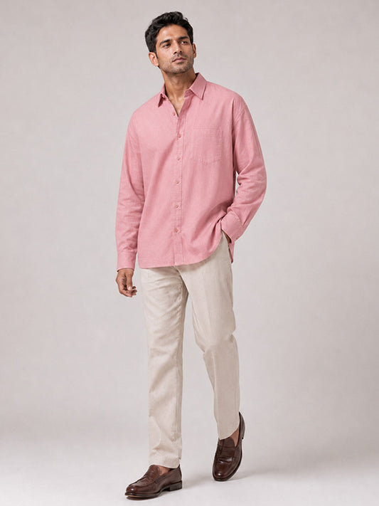 Man wearing a blush pink linen-cotton relaxed-fit full-sleeve shirt