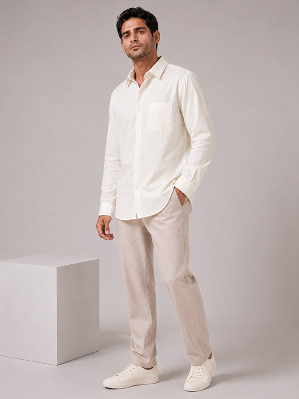 Man wearing a cream cotton relaxed-fit full-sleeve shirt with matching trousers