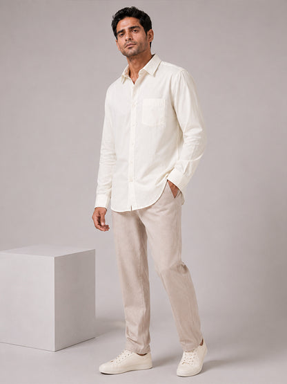 Man wearing a cream cotton relaxed-fit full-sleeve shirt with matching trousers