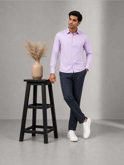 Full-length look of men's lavender cotton shirt styled with black trousers