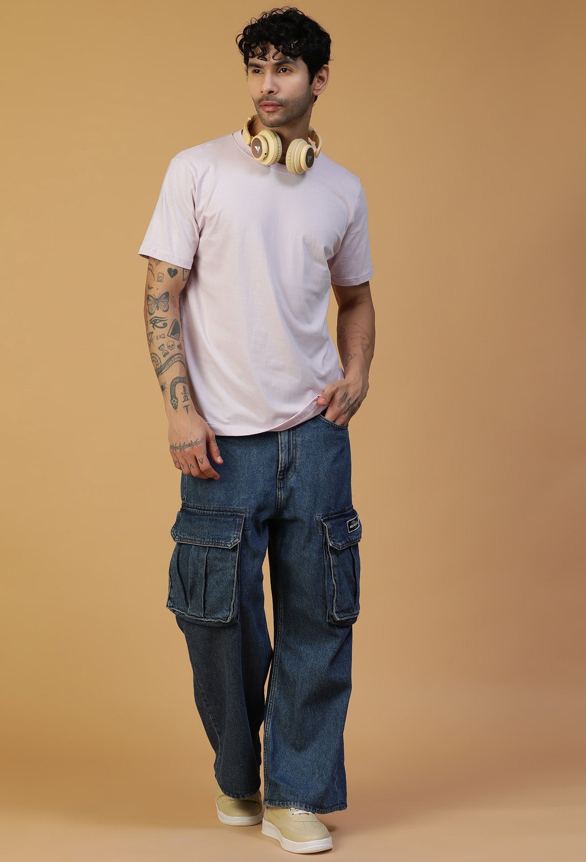 Full-length view of men's lavender cotton T-shirt with blue jeans