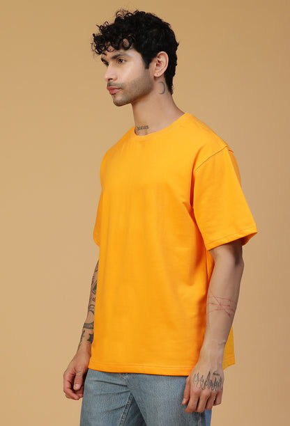 Three-quarter view of men's mustard oversized T-shirt