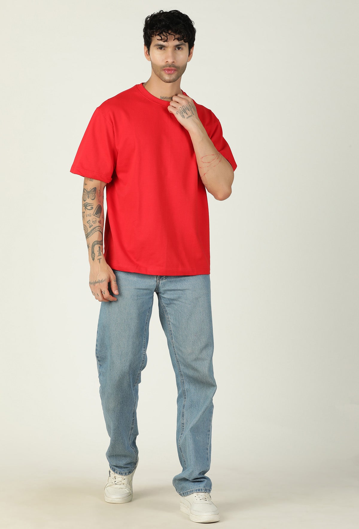 Full-length view of men's solid red oversized cotton T-shirt