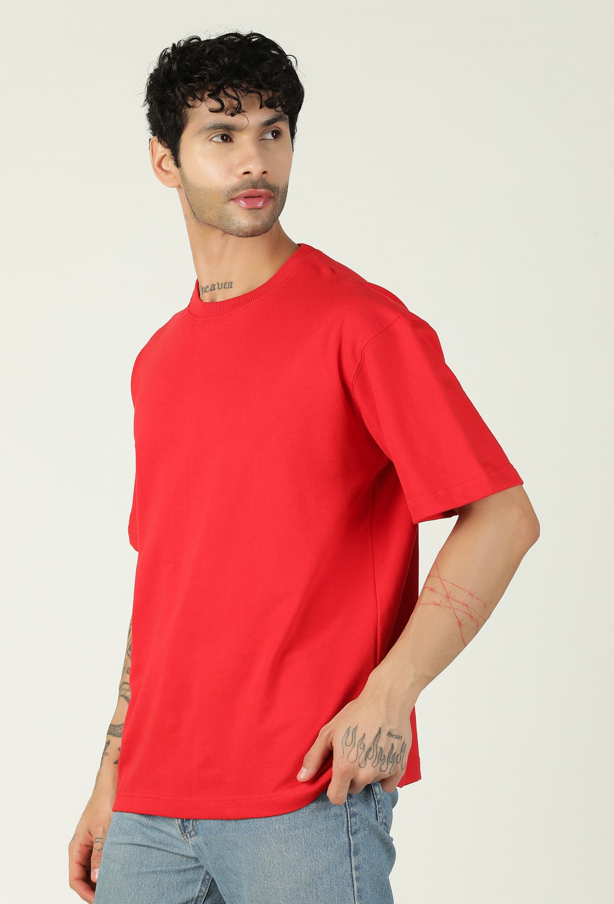 Side view of men's solid red oversized cotton T-shirt