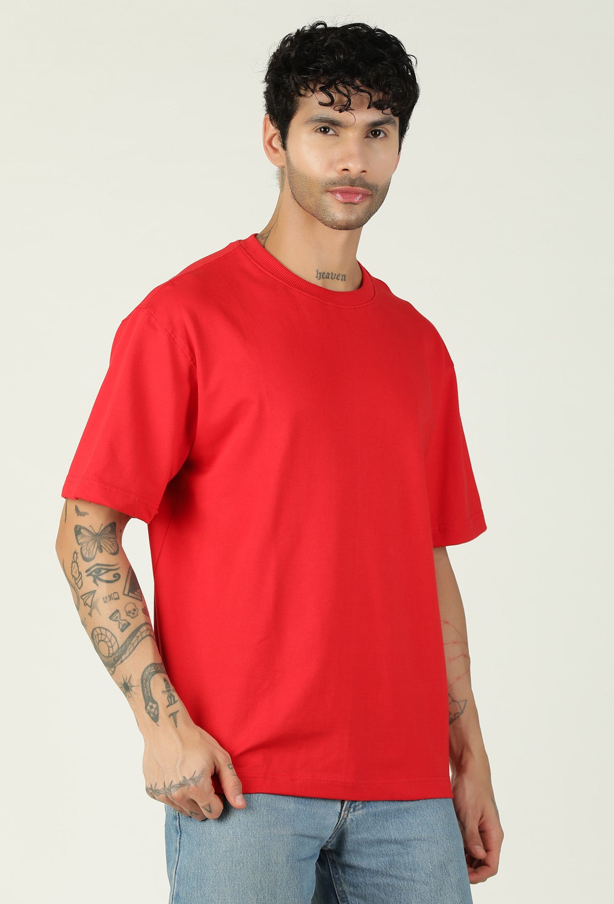 Three-quarter view of men's solid red oversized T-shirt