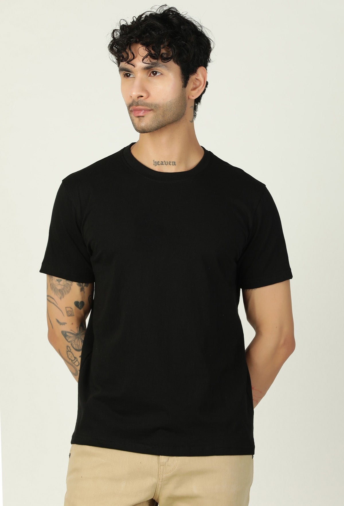 Man wearing a solid black premium cotton regular-fit T-shirt