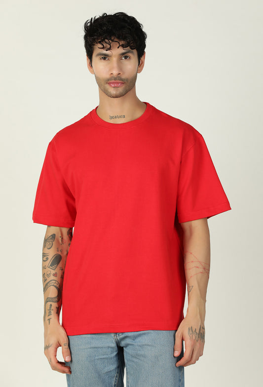 Man wearing a solid red pure cotton oversized T-shirt
