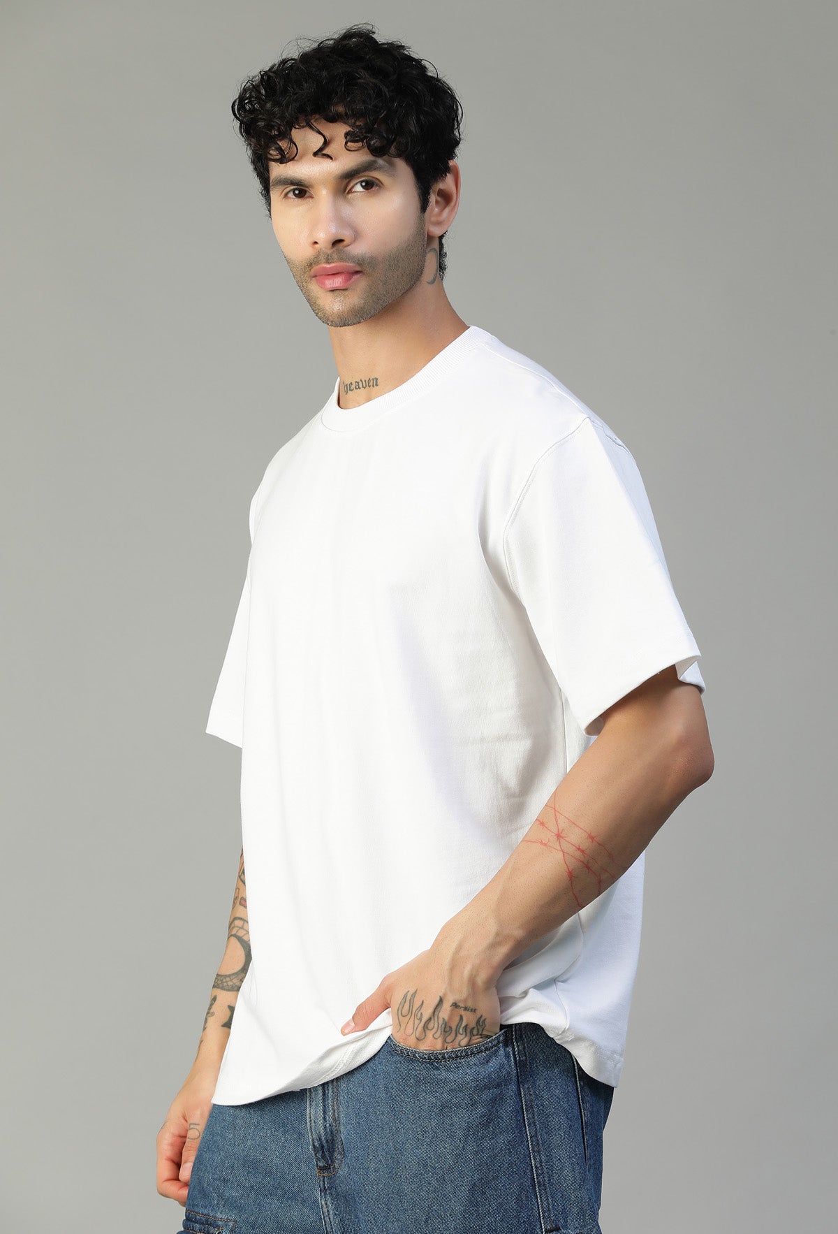 Man wearing a solid white pure cotton oversized T-shirt