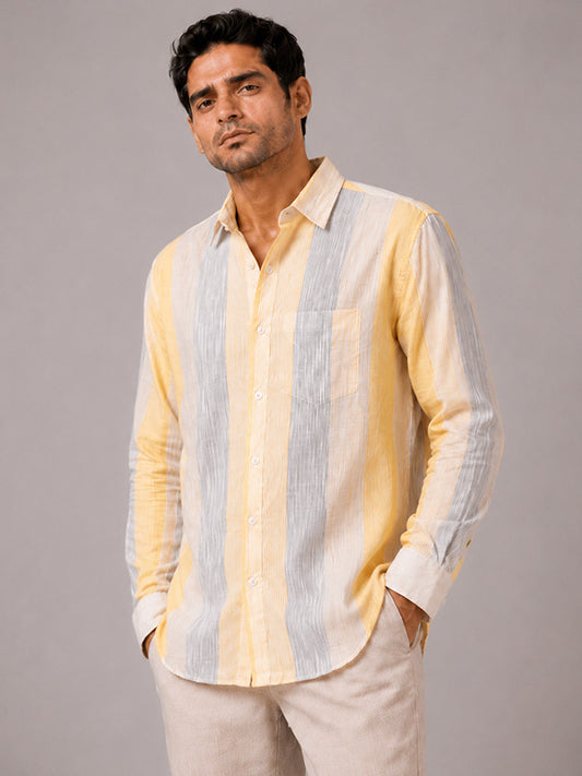 Man wearing a yellow, grey and white striped linen-cotton full-sleeve shirt