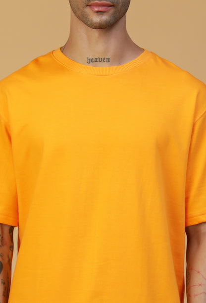 Close-up of mustard cotton oversized T-shirt crew neck and fabric