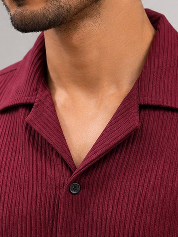 Close-up of wine textured shirt with camp collar and vertical ribbing